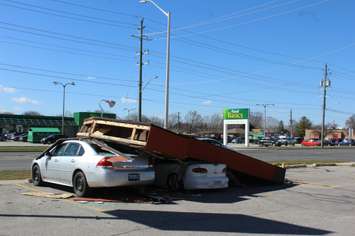 A sign fell on two cars at a plaza on St. Clair St. in Chatham. March 8, 2017. (Photo by Natalia Vega)
