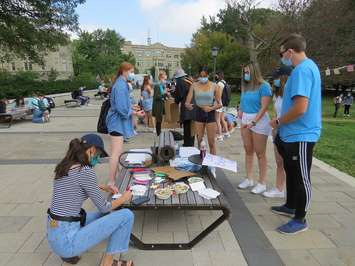 Western students make signs ahead of a walkout in support of survivors of sexual violence at Western University, September 17, 2021. (Photo by Miranda Chant, Blackburn News)