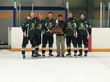 Clarke Pollock (Kincardine) presents the Pollock Division trophy after Game 6 of the final. (Photo by Ryan Drury)