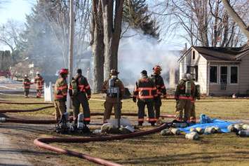Essex firefighters battle a residential blaze in the 100-block of Park St. in Harrow, March 18, 2015. (Photo by Mike Vlasveld)