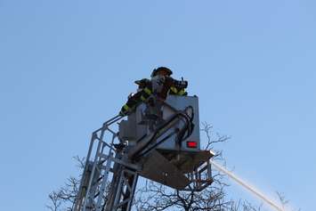 Firefighters at the scene of two house fires in the 800-block of Assumption St. in Windsor March 2, 2015. (Photo by Adelle Loiselle.)