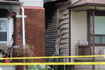 Police and fire officials investigate a fatal fire on Aubin Rd., August 12, 2015. (Photo by Jason Viau)
