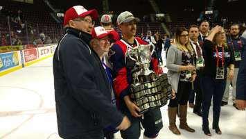 Adam Laishram of the Windsor Spitfires poses with the Memorial Cup after the Spitfires 4-3 title win over Erie at the WFCU Centre in Windsor (Photo by Mark Brown/Blackburn News)