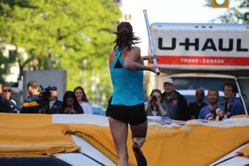 Athletes compete in a pole vaulting competition on Ouellette Ave., May 22, 2015. (Photo by Jason Viau)
