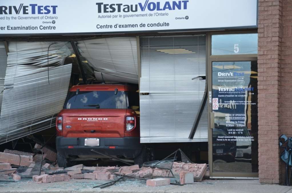 Driver charged after car crashes into building