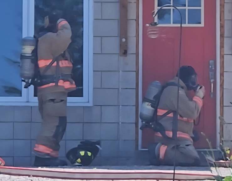 Firefighters preparing to enter a home, full of dark smoke. July 3, 2025. (Photo courtesy of the Lambton Shores Fire Department)