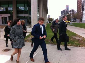 Former Windsor Spitfires Forward Ben Johnson walks from the Ontario Court of Justice, November 12, 2015. (Photo by Mike Vlasveld)