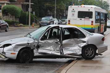 A car and a Transit Windsor bus collide at the intersection of Erie and Goyeau, August 10, 2015. (Photo by Jason Viau)