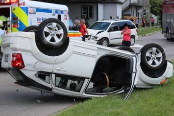 EMS crews tend to a number of people after a crash between a car and minivan at St. Luke Rd. and Richmond St., July 31, 2015. (Photo by Mike Vlasveld)