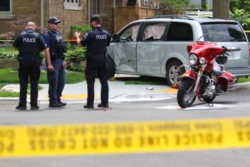 Windsor police investigate a crash involving a motorcycle and van at the intersection of Chilver Rd. and Richmond St., June 4, 2015. (Photo by Jason Viau)