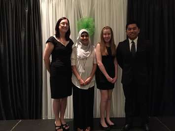The Next Generation Leadership Forum winners (Saba Siddiqui, Jacklyn Janssen and Cody Benito) stand with Barb Smith, the president of Junior Achievement Southwestern Ontario (far left), during Junior Achievement's Evening of Excellence at the John D. Bradley Convention Centre in Chatham, May 7, 2015. (Photo courtesy of Katy Uher)
