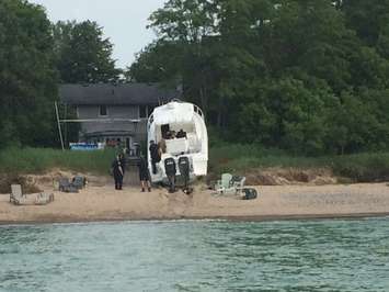 Police respond after a boat crashes into the shore near Canatara Park Beach, July 3, 2015. (Photo by Sue Storr)