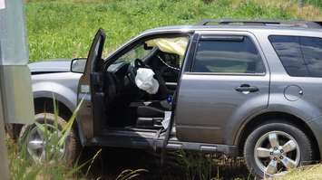 Vehicle hits the ditch at Queens St. and Lakeshore Rd. near Camlachie June 29, 2015 (BlackburnNews.com Photo by Briana Carnegie)