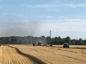 Combine and field fire July 10/18. BlackburNews.com photo by Sue Storr.