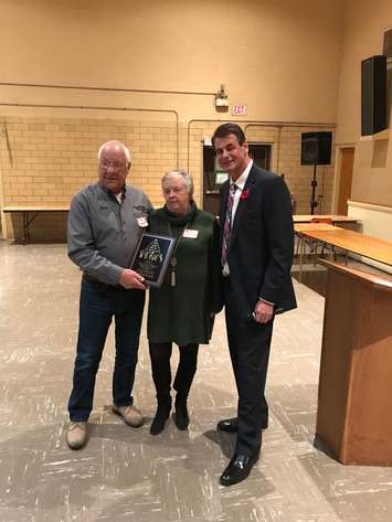 John and Barb Verkaik (left) receive the Chatham Goodfellows' 2019 President's Award from director Tim Haskell. (Photo by Amanda Thibodeau)