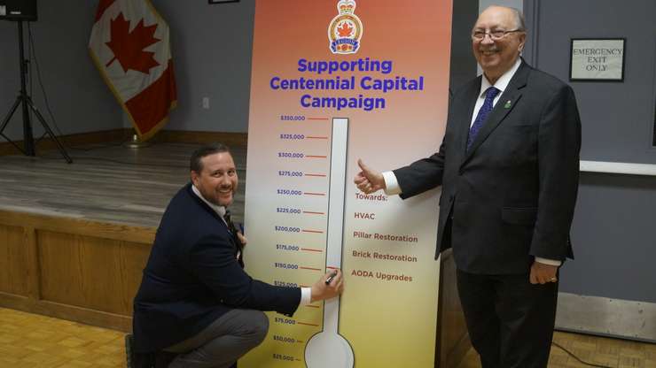 Sarnia Legion Branch 62 President Ron Realesmith and MPP Bob Bailey marking amount raised (Photo by: Lindsay Newman/ Blackburn Media)