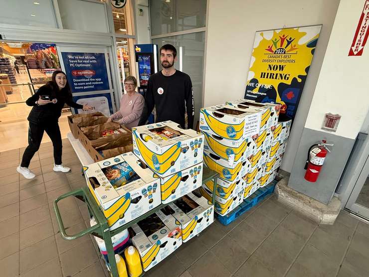 Volunteers pose for a photo at a Knights of Columbus food donation drive for the Salvation Army of Chatham-Kent food bank. April 2025. (Photo courtesy of Knights of Columbus Council 1412 via Facebook)