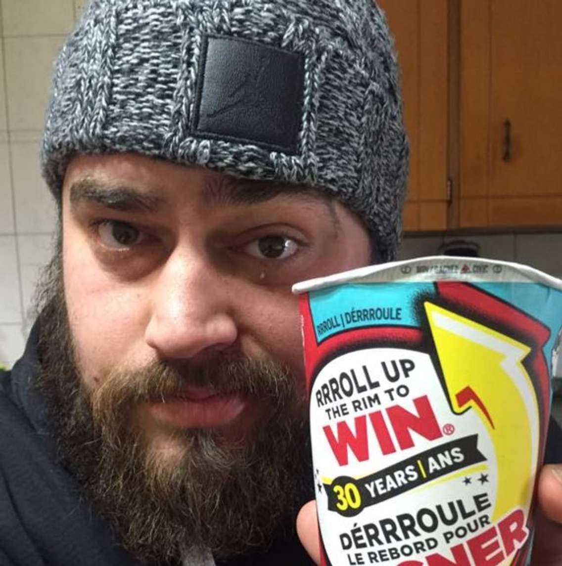 Kortney Merilees displays his winning cup. (Photo provided by Kortney Merilees)