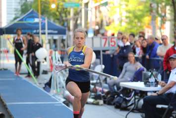 Athletes compete in a pole vaulting competition on Ouellette Ave., May 22, 2015. (Photo by Jason Viau)