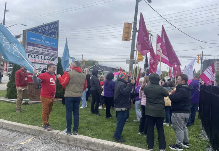 Education union members meet outside Windsor-Tecumseh MPP Andrew Dowie's constituency office in Windsor, April 29, 2026. Photo by Maureen Revait/WindsorNewsToday.ca.