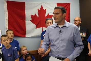 With his family behind him, Conservative MP Jeff Watson opens his campaign office in Essex, September 11, 2015. (Photo by Mike Vlasveld)