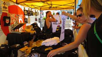 A vendor sells Tragically Hip merchandise outside of Budweiser Gardens, August 8, 2016. (Photo by Miranda Chant, Blackburn News)