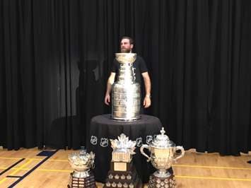 Ryan O'Reilly awaits fans to come take pictures with him and a serious collection of hardware. (Photo by Ryan Drury)