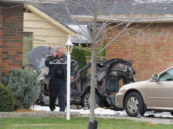 Fire officials investigate a vehicle explosion at a home on Wood St. in St. Thomas. (Photo by Miranda Chant, BlackburnNews.com)