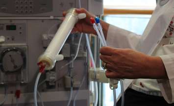 RN Madeline Power demonstrates how a dialysis machine is used at Windsor Regional Hospital, March 12, 2015. (Photo by Mike Vlasveld)