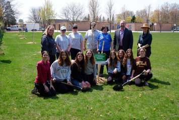 St. Michael Catholic School staff and students pose with SCRCA and Lambton Public Health representatives in front of a newly planted tree at the Sarnia schoolyard as part of the Tomorrow’s Greener Schools Today – Lambton program. Submitted photo.