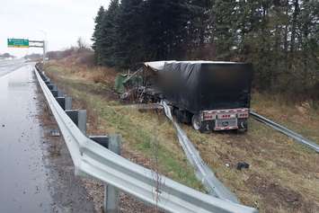 A transport truck crashed through a guardrail along the westbound lanes of Highway 401 near Sweaburg Road, November 21, 2023. Photo provided by Oxford OPP.