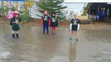 Enjoying the puddles at the 2017 IPM near Walton on Tuesday, September 19. (Photo by Adam Bell)