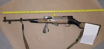 A rifle found inside a burned Devine Street apartment July 26/25 (Photo courtesy of Sarnia Police Service)