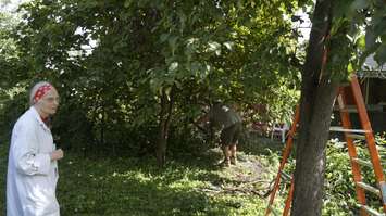 Jessie Rabbitt stands in her backyard during the United Way's Day of Caring. September 11, 2018. (Photo by Colin Gowdy, BlackburnNews)