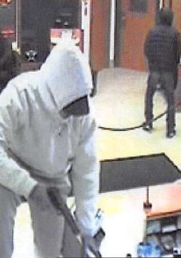 Surveillance image of two  suspects wanted in relation to the CIBC bank robbery in Markham, March 7, 2018. Photo courtesy of OPP.
