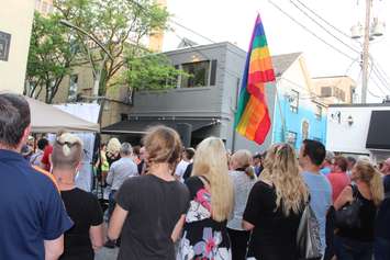 A Pride flag is flown at a vigil held in Windsor after the deadly shooting at a gay nightclub in Orlando. (Photo by Ricardo Veneza)