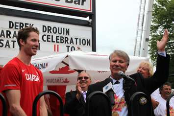 St. Clair Township Mayor Steve Arnold introduces Corunna Olympic champion Derek Drouin at homecoming Aug. 27, 2016 (BlackburnNews.com photo by Dave Dentinger)