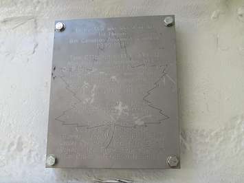 A plaque mounted inside of the Holy Roller with the names of its D-Day crew members. (Photo by Miranda Chant, Blackburn Media)