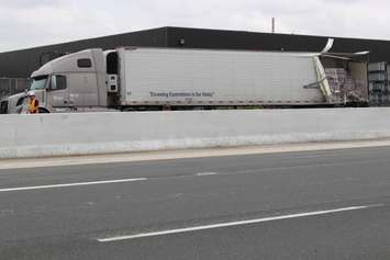 Two transport trucks collide in the eastbound lanes of Hwy. 401 just west of the Dougall overpass, June 18, 2015. (Photo by Jason Viau)