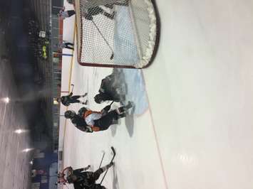 Blyth-Brussels goalie covers the puck. (Photo by Marty Thompson)