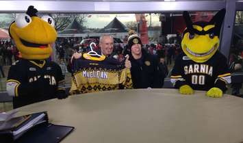 Ron MacLean is presented a special Sting jersey from the recent Ugly Christmas Sweater  fundraiser Dec. 20, 2015 (Hometown Hockey photo via Twitter)