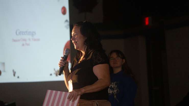 Representative from St. Vincent de Paul Society speaks to St. Pat's students during pep rally. December 3, 2024. (Photo by Natalia Vega) 