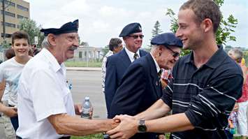 Normandy student, Guillaune Blottiere thanks Sarnia veterans for their service. August 18, 2015 (BlackburnNews.com Photo by Briana Carnegie)