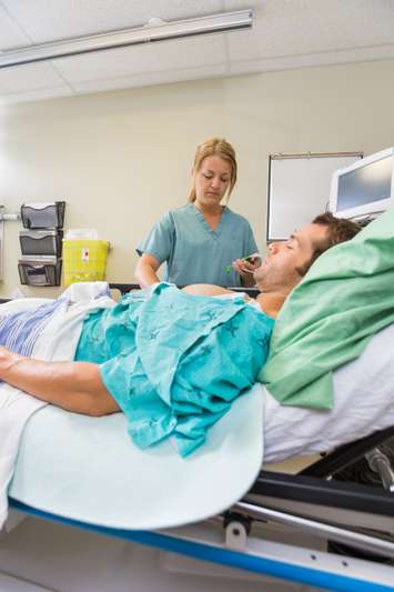 Nurse examining a patient in a hospital emergency room. © Can Stock Photo / Leaf