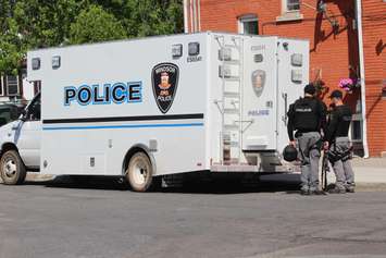 Windsor police officers investigate the 900-block of Pillette Rd. where a gunman was arrested, June 1, 2016. (Photo by Jason Viau)