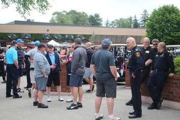 Windsor Police Chief Al Frederick, right, and Mayor Drew Dilkens socialize before the CanAm Golf Series at Roseland Golf and Curling Club, June 17, 2019. Photo by Mark Brown/Blackburn News.