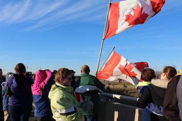 Supporters come out to the Communications Rd. overpass on Hwy. 401 for the repatriation ceremony of fallen veteran and Wheatley native John Gallagher on November 20, 2015. (Photo by Ricardo Veneza)