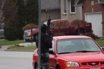Windsor police ESU surround house in east Windsor to serve an outstanding arrest warrant, December 1, 2015. (Photo by Maureen Revait) 
