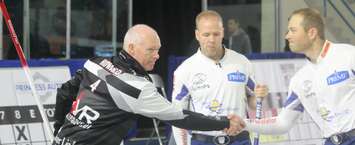Glenn Howard shakes hands with Team Gushue after a big win in the third draw of the Pinty's Grand Slam of Curling Elite 10. September 27, 2018. (Photo by Greg Higgins)