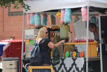A woman at a food vendor at Buskerville Festival in Windsor, August 11 2018 (Photo by Adelle Loiselle)